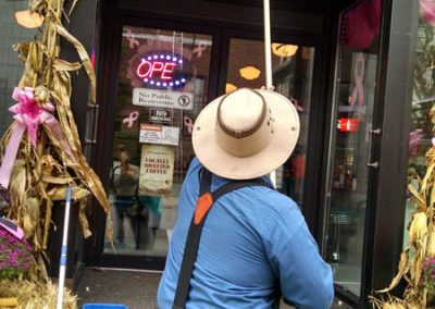 Cleaing the Windows of A Piece Of Cake Bakery
